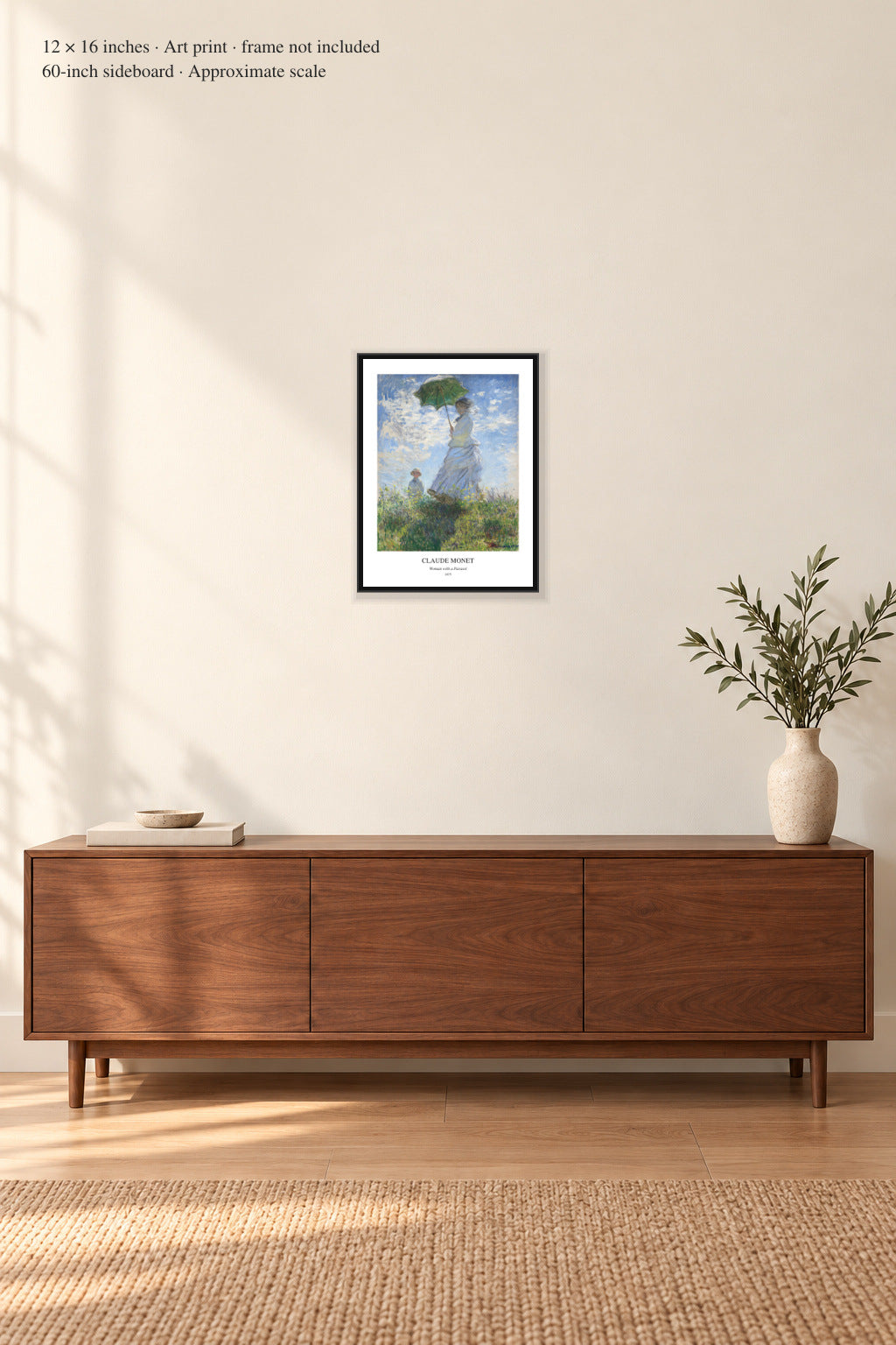 Claude Monet — Woman with a Parasol in a black frame above a walnut sideboard. Frame shown for styling.