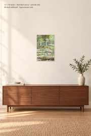 Bridge over a Pond of Water Lilies · 12 × 18 inches · Stretched canvas · artwork only · room mockup · approximate scale against 60-inch sideboard