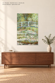 Bridge over a Pond of Water Lilies · 24 × 36 inches · Stretched canvas · artwork only · room mockup · approximate scale against 60-inch sideboard