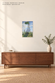 Woman with a Parasol · 12 × 18 inches · Stretched canvas · artwork only · room mockup · approximate scale against 60-inch sideboard