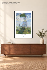 Woman with a Parasol · 24 × 36 inches · Art print · frame not included · room mockup · approximate scale against 60-inch sideboard