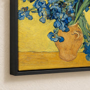 Irises — black floater frame corner detail mockup showing matte canvas texture and shadow gap