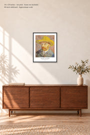 Self-Portrait with a Straw Hat · 16 × 20 inches · Art print in a simple black frame · frame not included · room mockup · approximate scale against 60-inch sideboard
