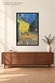 Café Terrace at Night · 24 × 36 inches · Canvas + black floater frame · room mockup · approximate scale against 60-inch sideboard